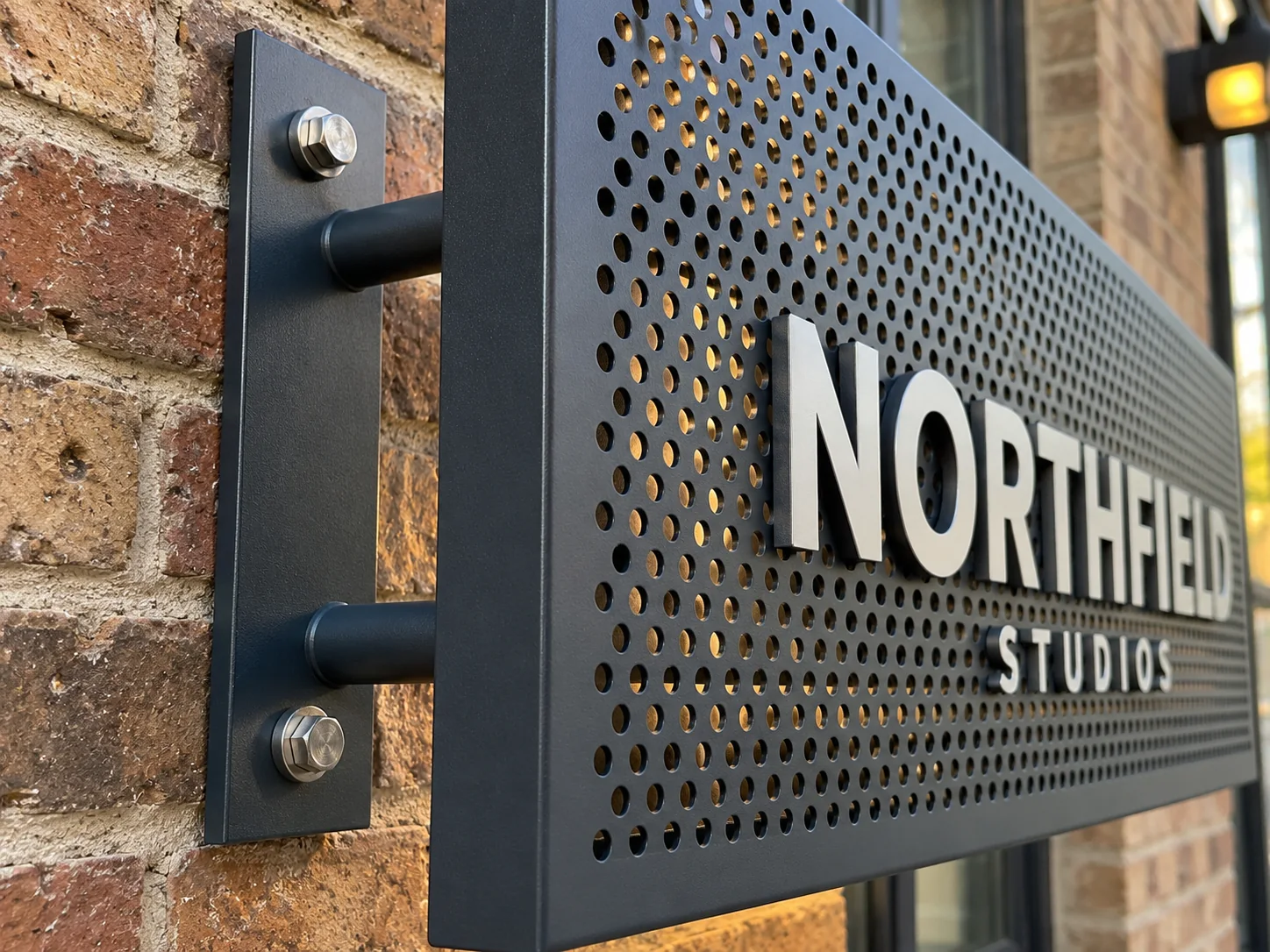 Lion Sign — Bespoke decorative perforated metal panels for commercial and architectural applications.