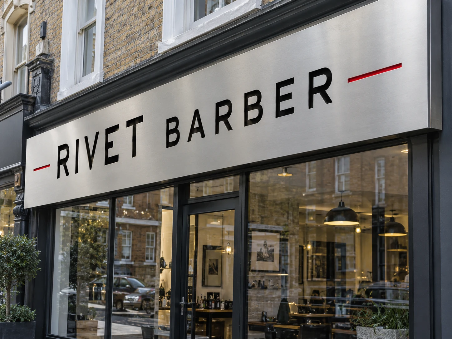 Lion Sign — Brushed-metal composite barber shop sign with recessed black acrylic letters.