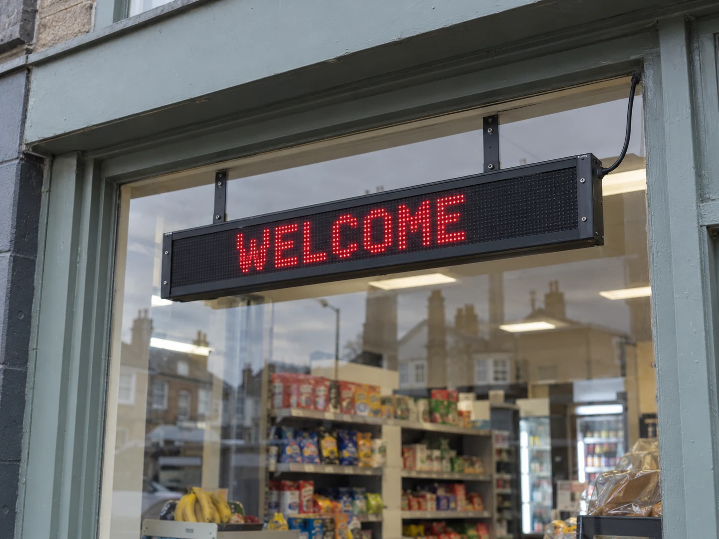 Lion Sign — Red dot-matrix LED welcome sign for shop windows and reception areas.
