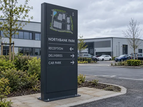 Lion Sign — Outdoor business park directory totem with site map and directional information.